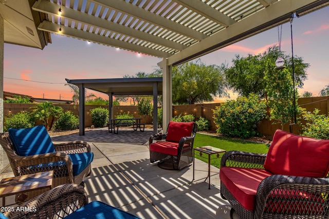 2910 S Olivewood, Mesa, AZ 85212 - patio terrace at dusk featuring outdoor lounge area, a fenced backyard, and a pergola