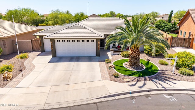 2910 S Olivewood, Mesa, AZ 85212 - view of front facade featuring a gate, a garage, concrete driveway, and a tile roof