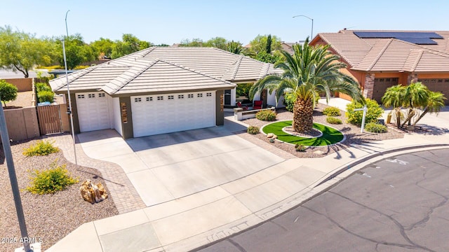 2910 S Olivewood, Mesa, AZ 85212 - ranch-style house with driveway, a garage, a tile roof, fence, and stucco siding