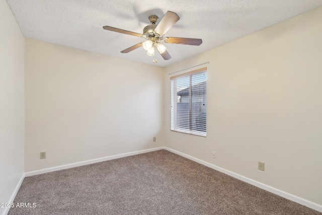 carpeted empty room with ceiling fan and a textured ceiling