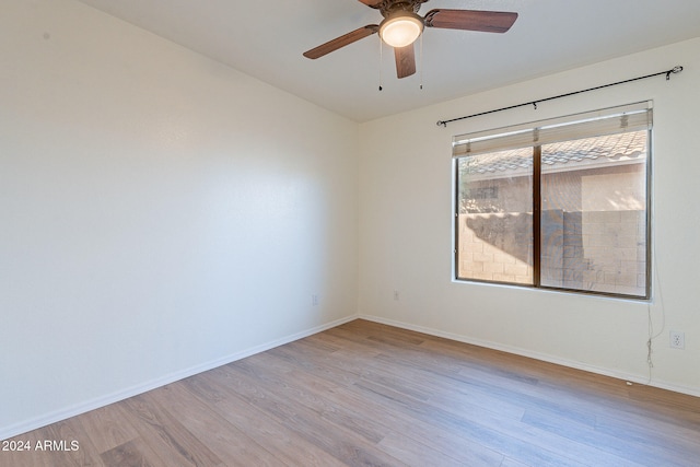 unfurnished room with ceiling fan and light wood-type flooring