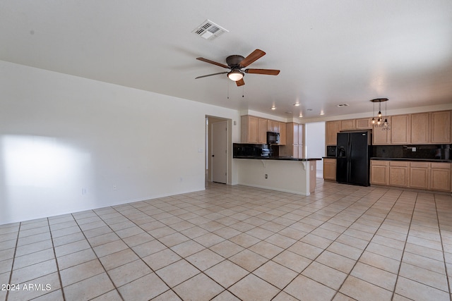 unfurnished living room with ceiling fan with notable chandelier and light tile patterned floors