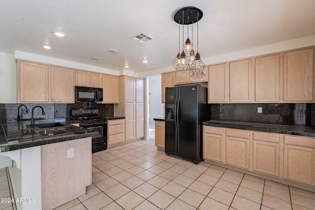 kitchen featuring black appliances, sink, backsplash, a breakfast bar, and light brown cabinets