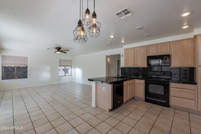 kitchen with black appliances, hanging light fixtures, decorative backsplash, sink, and kitchen peninsula