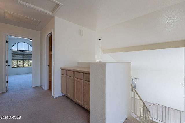 corridor with light colored carpet