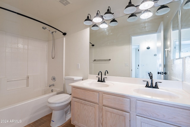 full bathroom with toilet, shower / bathing tub combination, vanity, and hardwood / wood-style floors