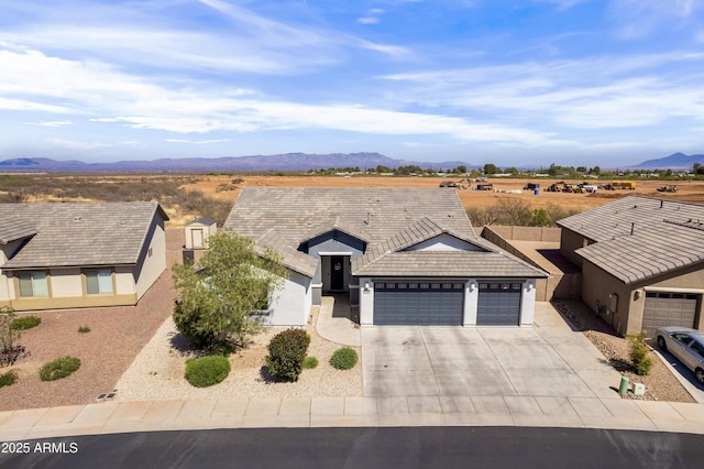 3523 W Rhapsody Dr, Sierra Vista, AZ 85650 - ranch-style home with driveway, a tile roof, a garage, a mountain view, and stucco siding