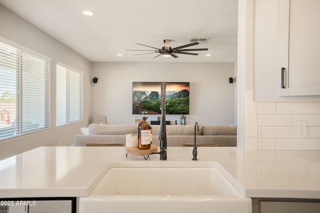 3523 W Rhapsody Dr, Sierra Vista, AZ 85650 - interior space featuring visible vents, backsplash, ceiling fan, and open floor plan