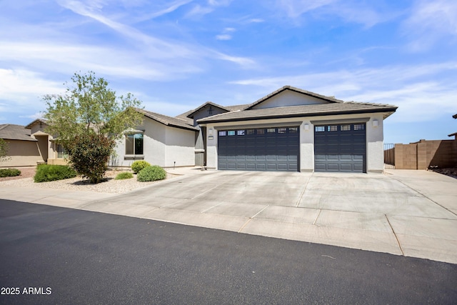 3523 W Rhapsody Dr, Sierra Vista, AZ 85650 - ranch-style house with a tile roof, fence, concrete driveway, an attached garage, and stucco siding
