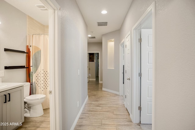 3523 W Rhapsody Dr, Sierra Vista, AZ 85650 - corridor with light wood-type flooring, recessed lighting, baseboards, and visible vents