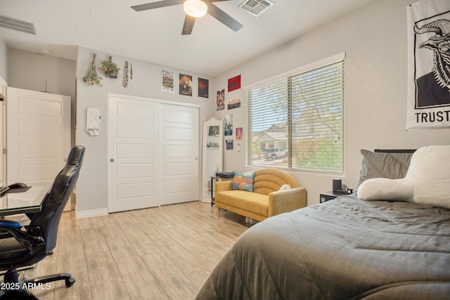 3523 W Rhapsody Dr, Sierra Vista, AZ 85650 - bedroom with light wood-style floors, a closet, a ceiling fan, and visible vents