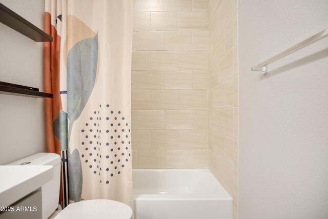 3523 W Rhapsody Dr, Sierra Vista, AZ 85650 - bathroom featuring a textured wall, shower / bath combo with shower curtain, and toilet