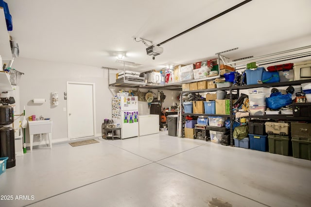 3523 W Rhapsody Dr, Sierra Vista, AZ 85650 - garage with freestanding refrigerator and a garage door opener