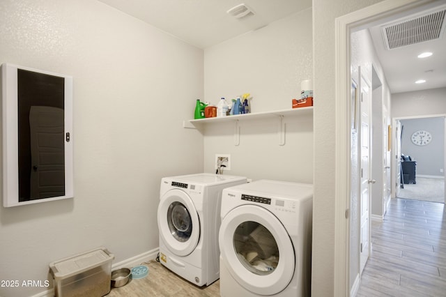 3523 W Rhapsody Dr, Sierra Vista, AZ 85650 - laundry area featuring laundry area, visible vents, light wood-type flooring, baseboards, and washer and clothes dryer