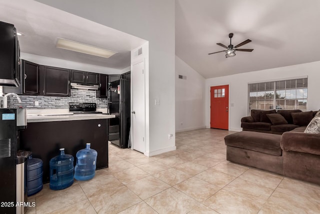 living room with a ceiling fan, light tile patterned floors, lofted ceiling, and baseboards