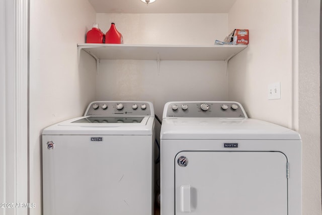 washroom featuring washer and dryer