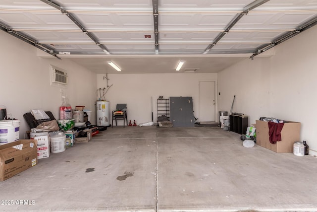 garage with water heater and an AC wall unit