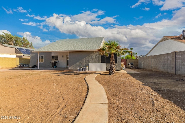 back of property featuring a patio area, a fenced backyard, and stucco siding