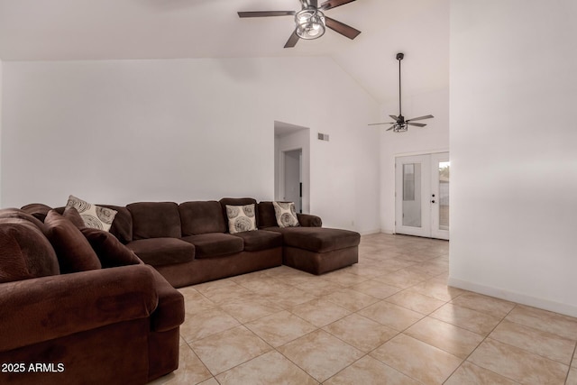 living room featuring a ceiling fan, high vaulted ceiling, light tile patterned floors, french doors, and baseboards
