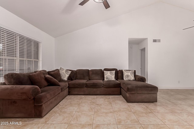 living room with a ceiling fan, light tile patterned flooring, and high vaulted ceiling