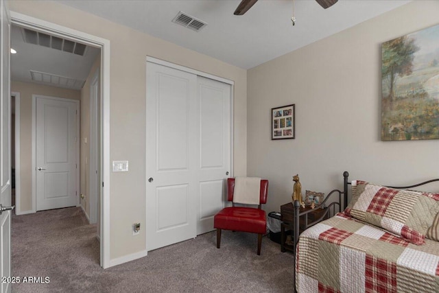 bedroom featuring carpet floors, a closet, baseboards, and a ceiling fan