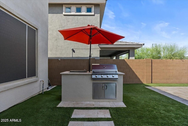 view of patio with a grill and exterior kitchen