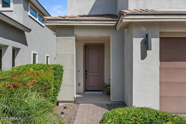 doorway to property with stucco siding