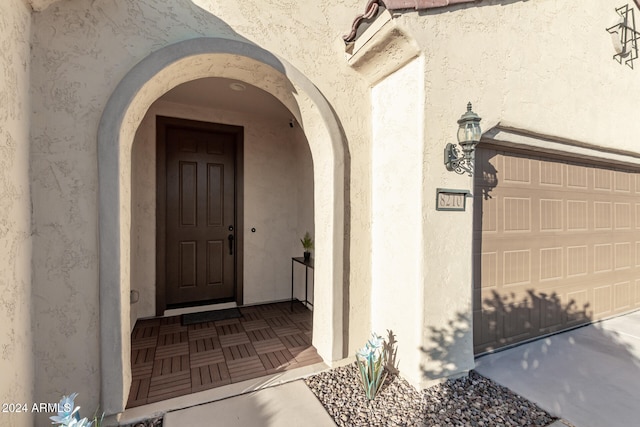 entrance to property featuring a garage