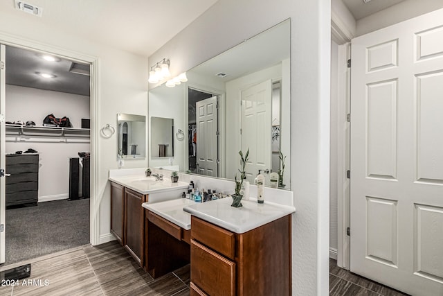 bathroom with hardwood / wood-style flooring and vanity