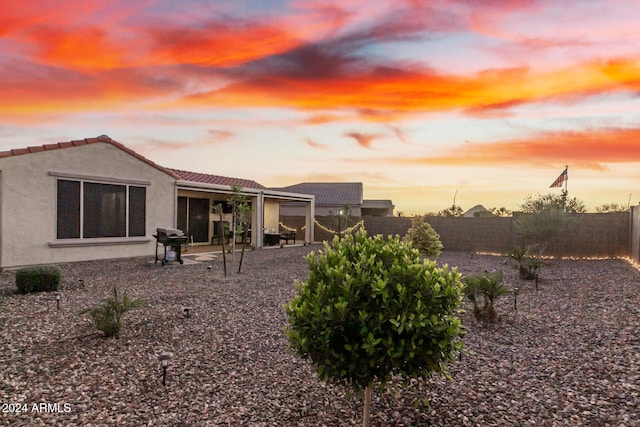 yard at dusk with a patio