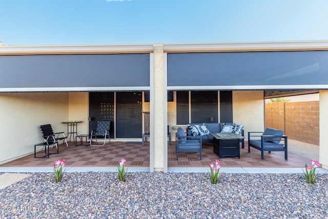 back of house with outdoor lounge area and a patio area