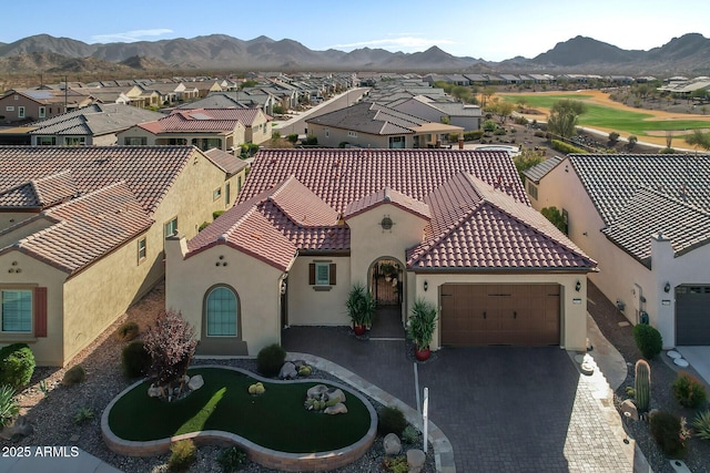 birds eye view of property with a mountain view