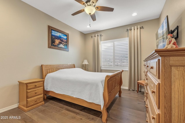 bedroom featuring dark hardwood / wood-style floors and ceiling fan