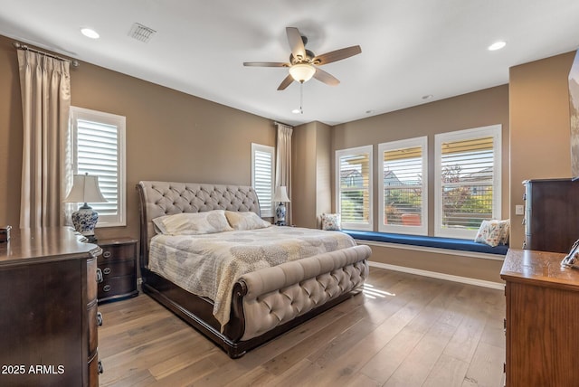 bedroom featuring ceiling fan and light hardwood / wood-style flooring