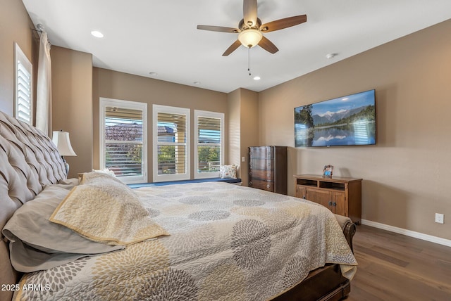 bedroom with ceiling fan and dark hardwood / wood-style flooring