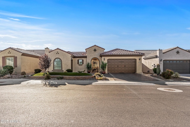 mediterranean / spanish-style house featuring a garage