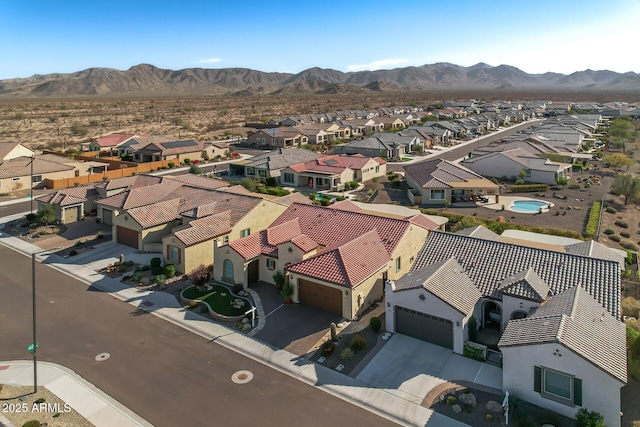 birds eye view of property with a mountain view