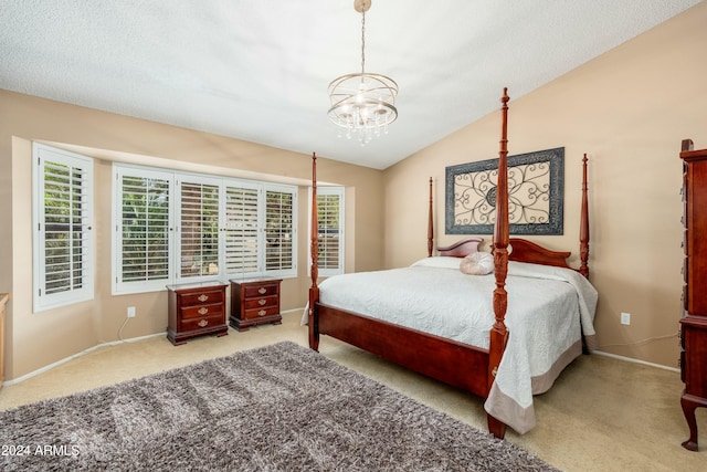 bedroom with a textured ceiling, a chandelier, light colored carpet, and lofted ceiling