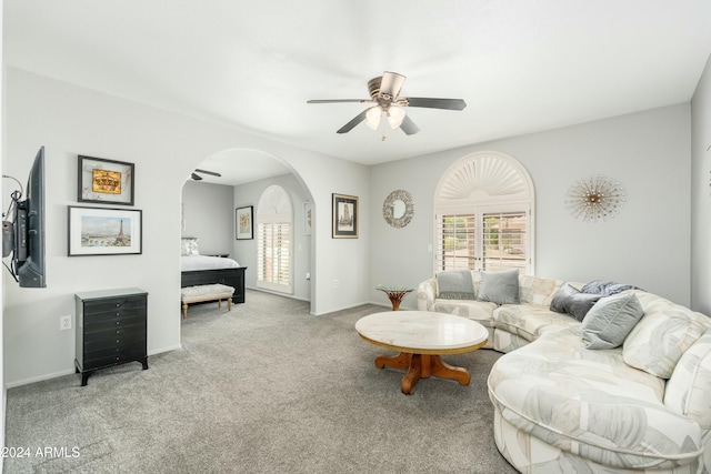 living room featuring ceiling fan and light carpet