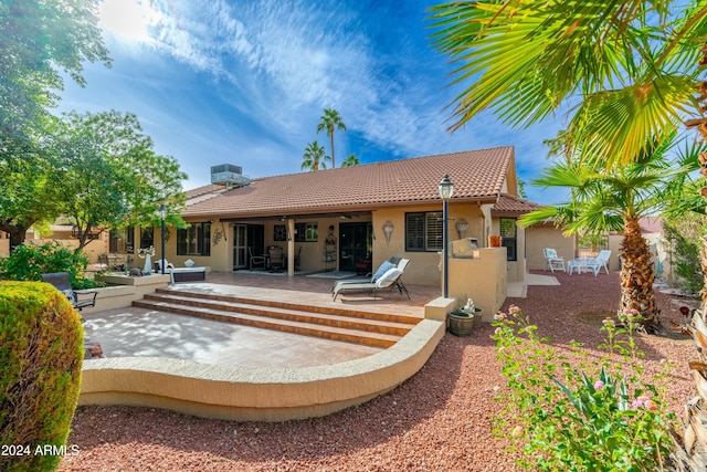 back of house with a patio area and central air condition unit