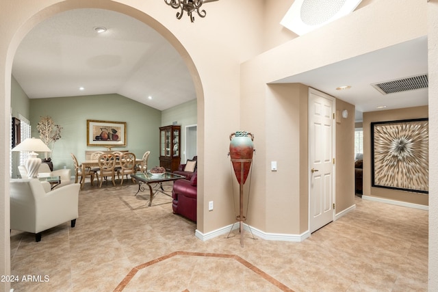 entryway featuring vaulted ceiling