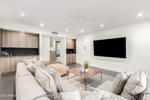 living room with recessed lighting, a ceiling fan, and baseboards