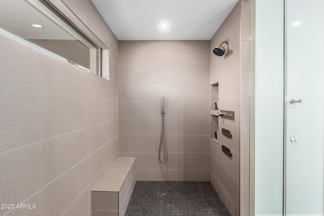 full bath with a tile shower