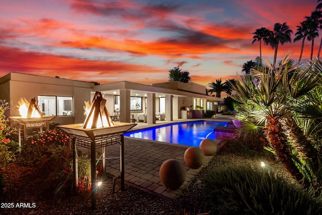 outdoor pool featuring a patio area