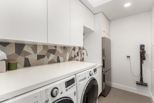washroom featuring independent washer and dryer, baseboards, light tile patterned flooring, and recessed lighting