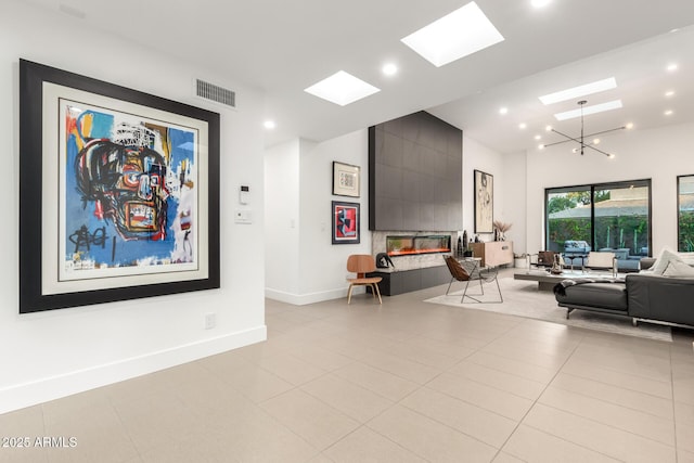 community lobby with high vaulted ceiling and recessed lighting