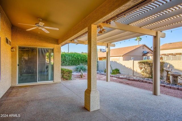 view of patio / terrace with fence, ceiling fan, and a pergola