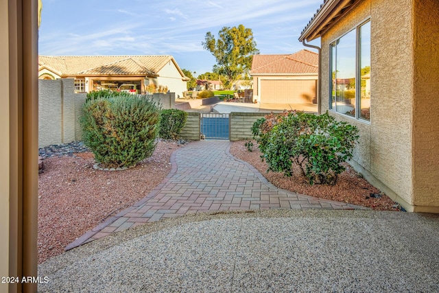 view of yard with fence and a gate