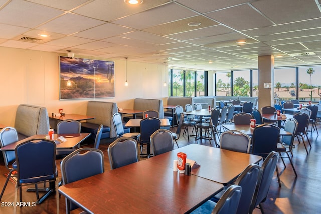 dining room with visible vents and a drop ceiling