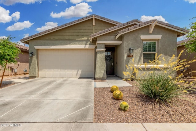 9418 W Minnezona Ave, Phoenix, AZ 85037 - view of front of property with stucco siding, an attached garage, a tiled roof, and driveway